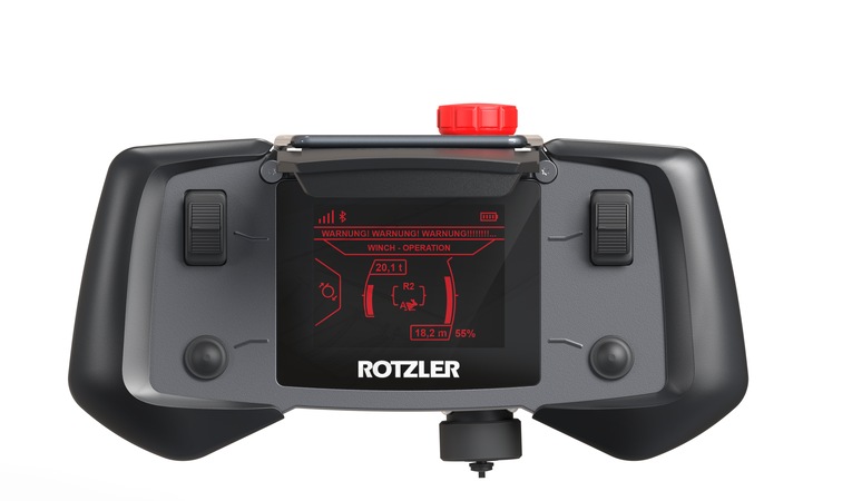 Ergonomisch gestaltete ROTZLER APEX Fernbedienung mit beidhändiger Bedienung, großen Bedienelementen und Handschuhbedienung für professionelle Bergesysteme.