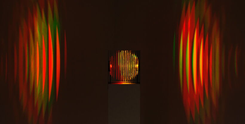 Front view of the atmosphero light installation featuring symmetrical light reflections, mirror technology and innovative product and lighting design.