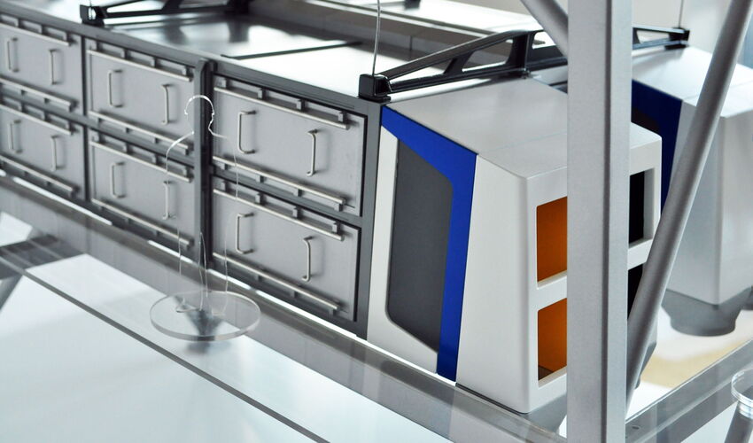 Close-up of the Dieffenbacher OSC trade show model featuring a precisely recreated screening machine and plant engineering details.
