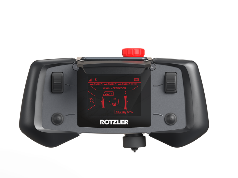 Ergonomisch gestaltete ROTZLER APEX Fernbedienung mit beidhändiger Bedienung, großen Bedienelementen und Handschuhbedienung für professionelle Bergesysteme.